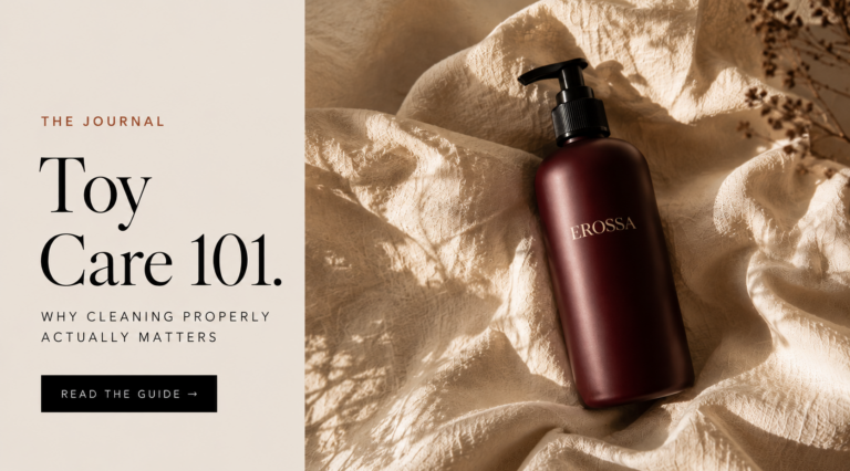 Editorial banner for the EROSSA guide to cleaning intimate products, showing a burgundy cleaner bottle on cream linen