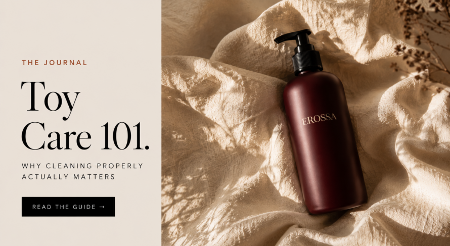 Editorial banner for the EROSSA guide to cleaning intimate products, showing a burgundy cleaner bottle on cream linen